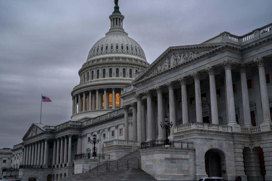The Senate side of the Capitol is seen in Washington, early Thursday, Dec. 22, 2022, as lawmakers rush to complete passage of a bill to fund the government before a midnight Friday deadline, at the Capitol in Washington, Thursday, Dec. 22, 2022. (AP Photo/J.