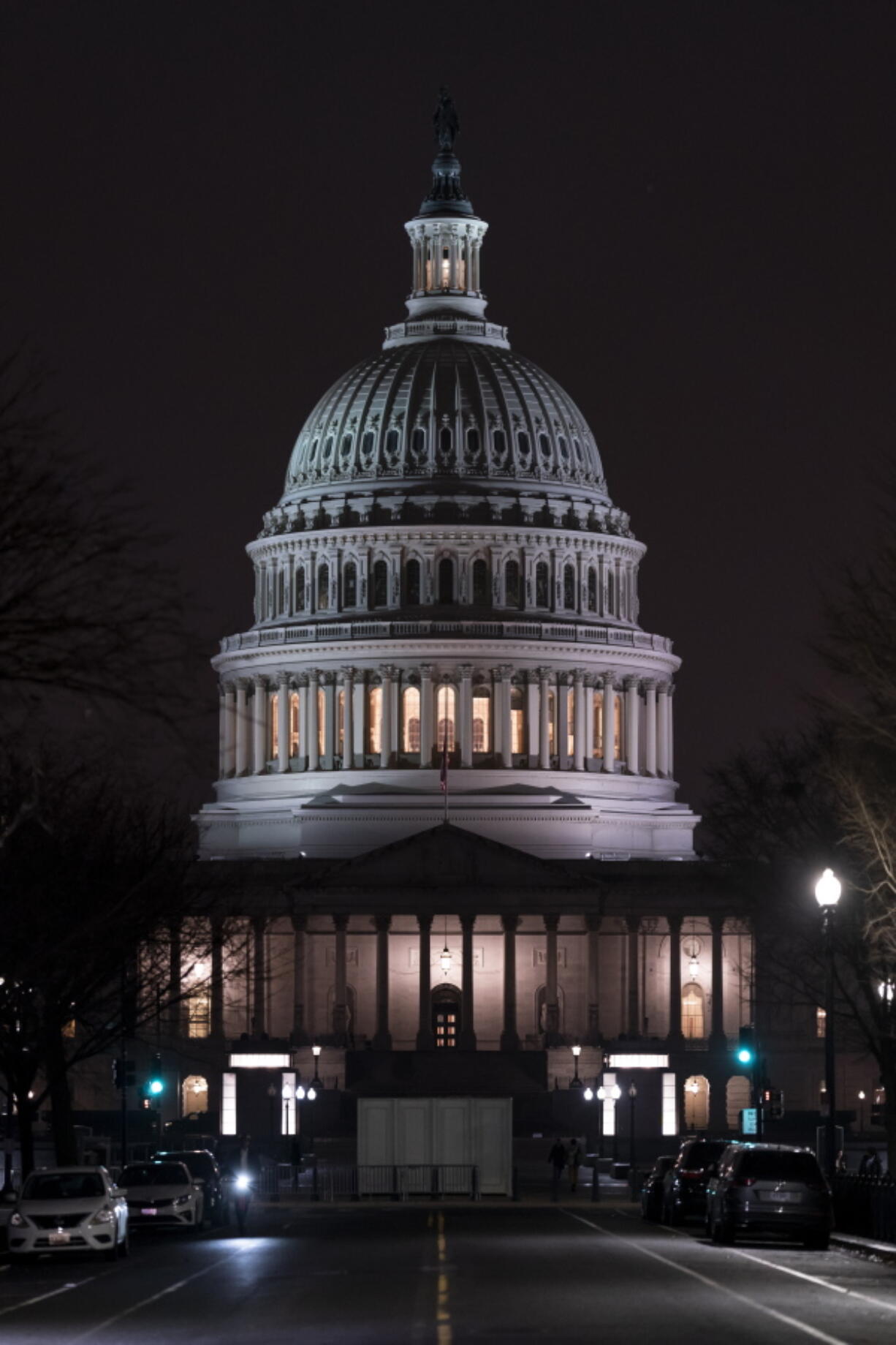 The Capitol is seen Wednesday evening as the House of Representatives works to approve the Respect for Marriage Act, a bill already passed in the Senate to codify both interracial and same-gender marriage, in Washington, Dec. 7, 2022. (AP Photo/J.