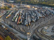 FILE - Freight train cars sit in a Norfolk Southern rail yard on Sept. 14, 2022, in Atlanta. The Biden administration is saying the U.S. economy would face a severe economic shock if senators don't pass legislation this week to avert a rail worker strike. The administration is delivering that message personally to Democratic senators in a closed-door session Thursday, Dec. 1.