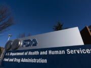 FILE - A sign in front of the Food and Drug Administration building is seen on Dec. 10, 2020, in Silver Spring, Md. Expedited drug approvals slowed in 2022, as the FDA's controversial accelerated pathway came under new scrutiny from Congress, government watchdogs and some of the agency's own leaders. With less than a month remaining in the year, the agency's drug center has granted 10 accelerated approvals -- fewer than the tally in each of the last five years, when use of the program reached all-time highs.