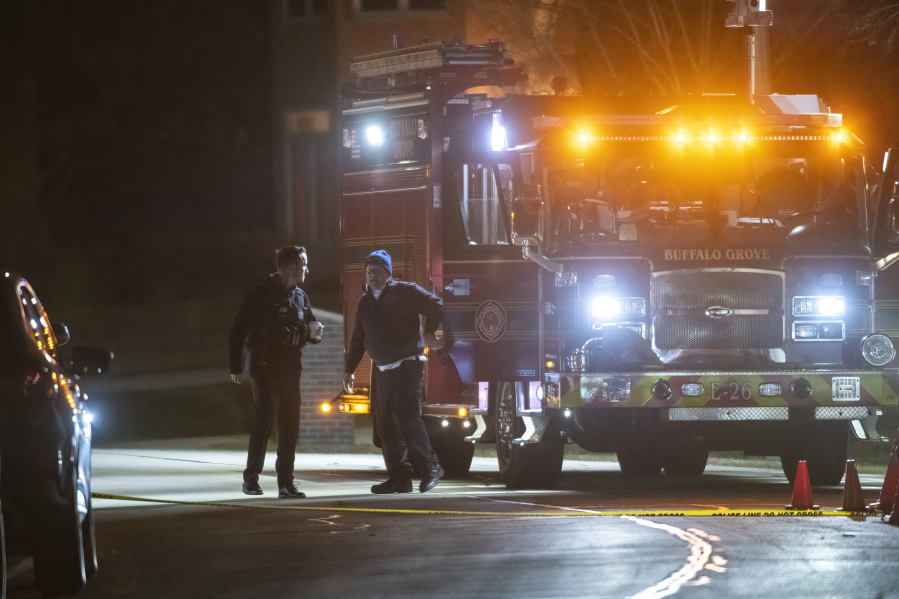 Buffalo Grove first responders work the scene where multiple people were found dead inside a home Wednesday evening, Nov. 30, 2022, in Buffalo Grove, Ill.