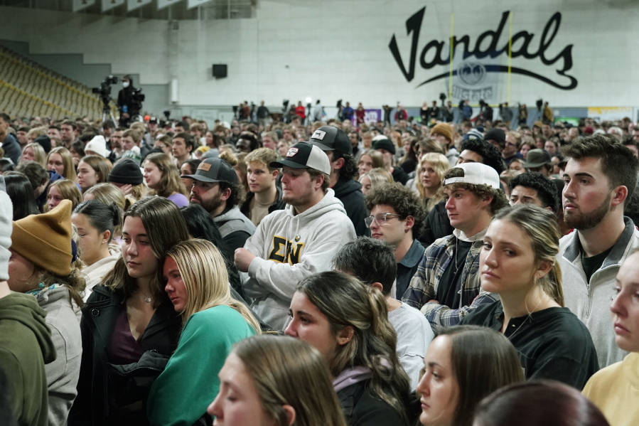 People attending a vigil for the four University of Idaho students who were killed on Nov. 13, 2022, stand in the Kibbie Dome as family members talk about their loved ones, Wednesday, Nov. 30, 2022, in Moscow, Idaho. (AP Photo/Ted S.
