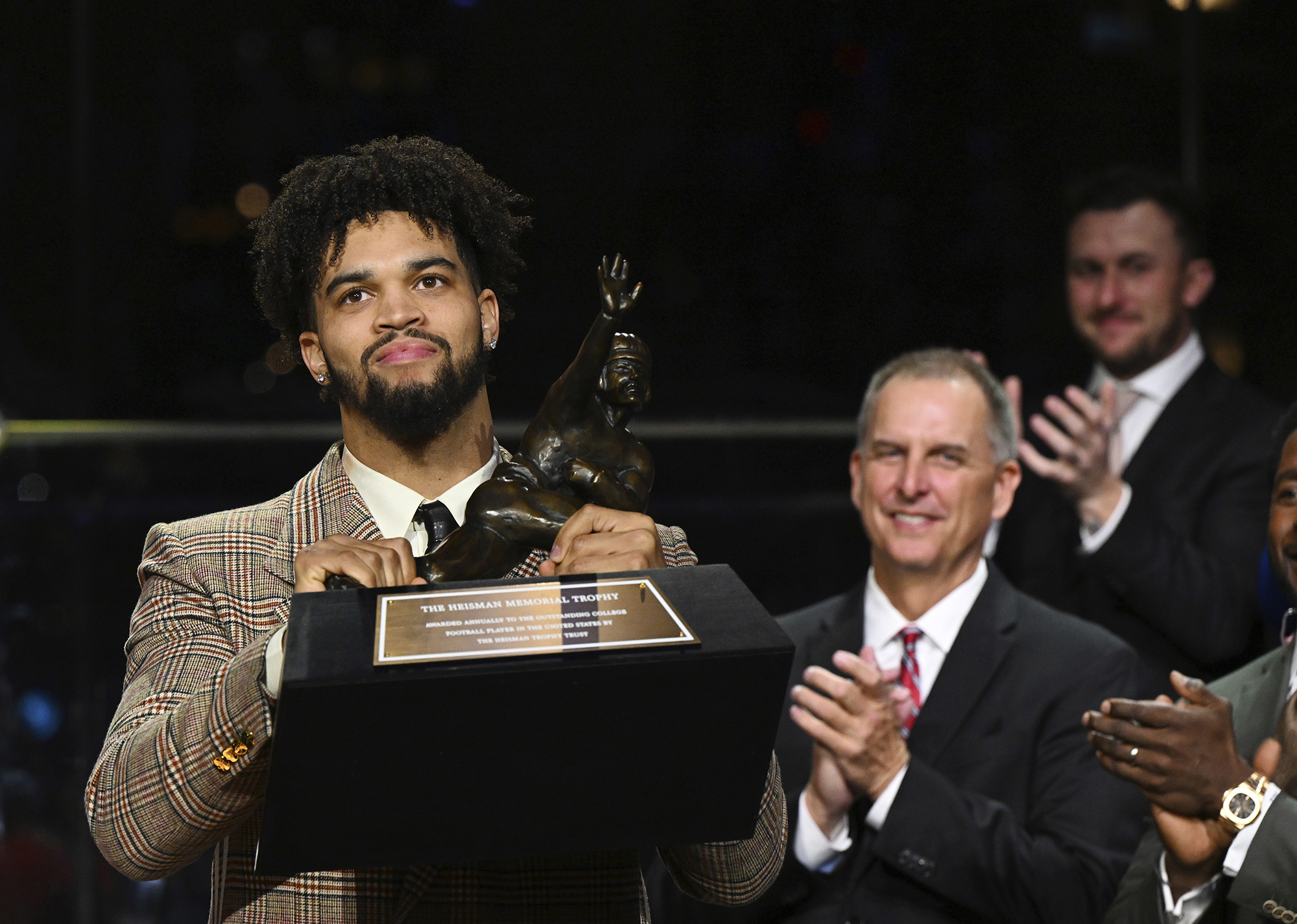 Southern California quarterback Caleb Williams holds the Heisman Trophy after winning the award Saturday, Dec. 10, 2022, in New York.