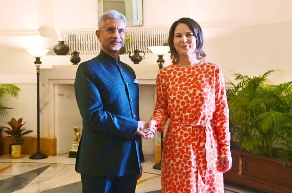 In this photo provided by Indian Foreign Minister S. Jaishankar's Twitter handle, Jaishankar and German Foreign Minister Annalena Baerbock, pose for a photograph during their meeting in New Delhi, India, Monday, Dec.5, 2022. (Indian Foreign Minister S.