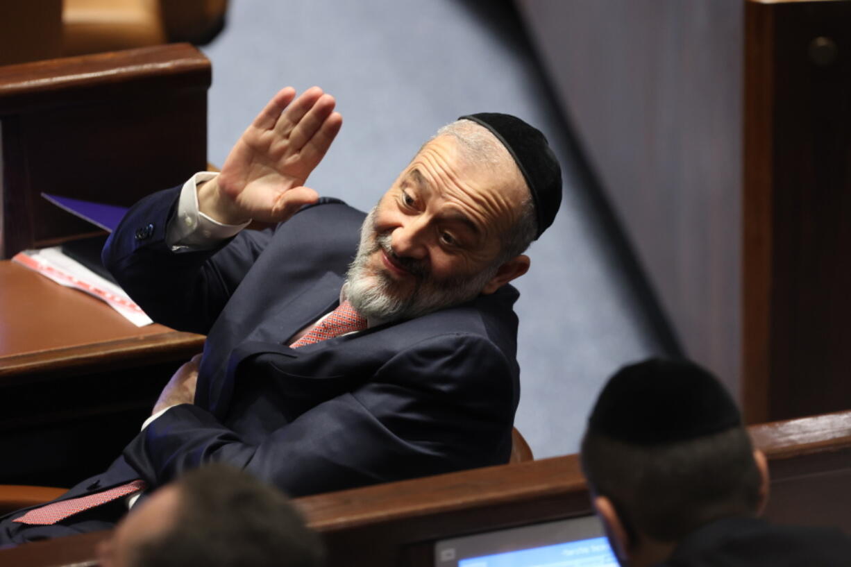 FILE - Member of Knesset Aryeh Deri waves during the swearing-in ceremony for Israeli lawmakers at the Knesset, Israel's parliament, in Jerusalem, Tuesday, Nov. 15, 2022. Designated Prime Minister Benjamin Netanyahu's Likud Party said Thursday, Dec. 8, 2022 it had reached a coalition deal with Shas, granting the ultra-Orthodox party control over several key ministries as it moved closer to forming a new government following Nov.