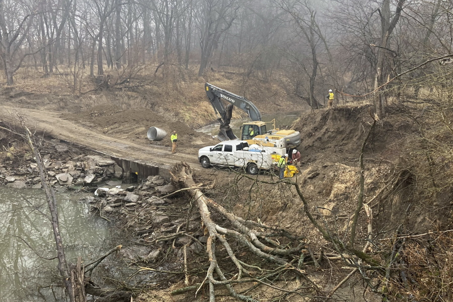 Washington County Road Department constructs an emergency dam to intercept an oil spill after a Keystone pipeline ruptured at Mill Creek in Washington County, Kanas, on Thursday, Dec 8, 2022. Vacuum trucks, booms and an emergency dam were constructed on the creek to intercept the spill.
