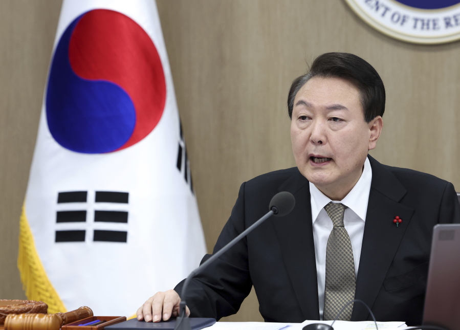 South Korean President Yoon Suk Yeol speaks during a cabinet council meeting at the presidential office in Seoul, South Korea, Tuesday, Dec. 27, 2022. South Korea's president on Tuesday called for a stronger air defense and high-tech stealth drones to better monitor North Korea, a day after it accused five North Korea of flying drones across the rivals' tense border for the first time in five years.