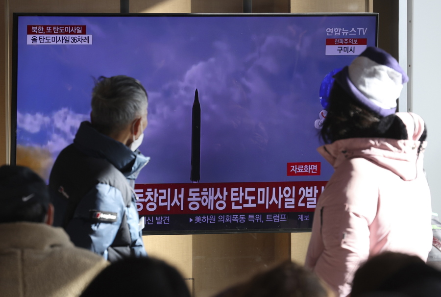 People watch a TV screen showing a news program about North Korea's missile launch with file footage, at the Seoul Railway Station in Seoul, South Korea, Sunday, Dec. 18, 2022. North Korea fired a pair of ballistic missiles on Sunday toward its eastern waters, its first weapons test in a month and coming two days after it claimed to have performed a key test needed to build a more mobile, powerful intercontinental ballistic missile designed to strike the U.S. mainland.