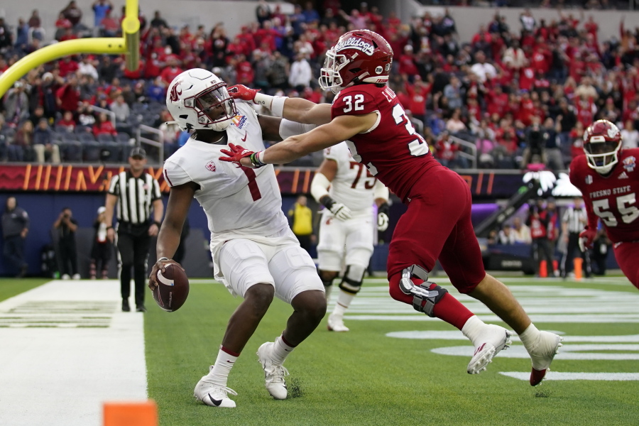 Fresno State defensive back Evan Williams (32) tackles Washington State quarterback Cameron Ward (1) in the end zone for a safety during the first half of the LA Bowl in Inglewood, Calif., Saturday, Dec. 17, 2022.