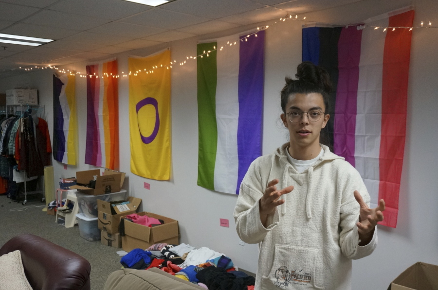 Sean Fisher, one of the student coordinators for QPLUS, the LGBTQ student organization for the College of Saint Benedict and Saint John's University, stands in the organization's dedicated lounge on the college's campus in St. Joseph, Minn., on Tuesday, Nov. 8, 2022. To Fisher, a senior in environmental studies who identifies as non-binary, the Catholic colleges' recognition and funding of the organization represents a new era.