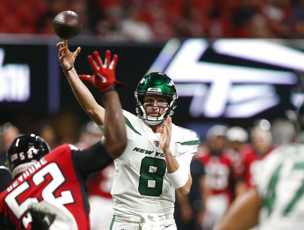 New York Jets quarterback Luke Falk (8) throws a pass in a preseason NFL football game against the Atlanta Falcons, Thursday, Aug. 15, 2019 in Atlanta.