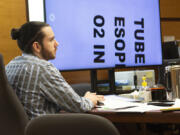 Elijah I. Partida, 24, listens to his defense attorney deliver closing arguments Nov. 17 to a Clark County Superior Court jury in his murder and manslaughter trial. Partida was accused of causing his infant daughter's fatal brain injuries in 2020. The jury convicted him of second-degree manslaughter.