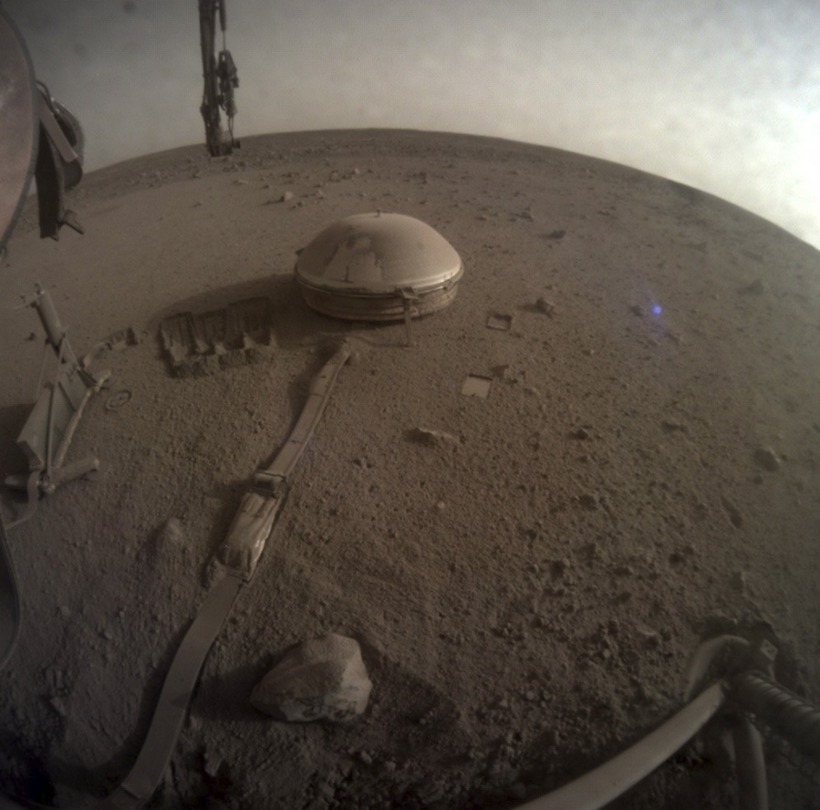This image released by NASA on Monday, Dec. 19, 2022, shows NASA's InSight lander on Mars. The lander's power levels have been dwindling for months because of all the dust coating its solar panels. While ground controllers at California's Jet Propulsion Laboratory knew the end was near, they did not expect InSight to fall silent over the weekend.