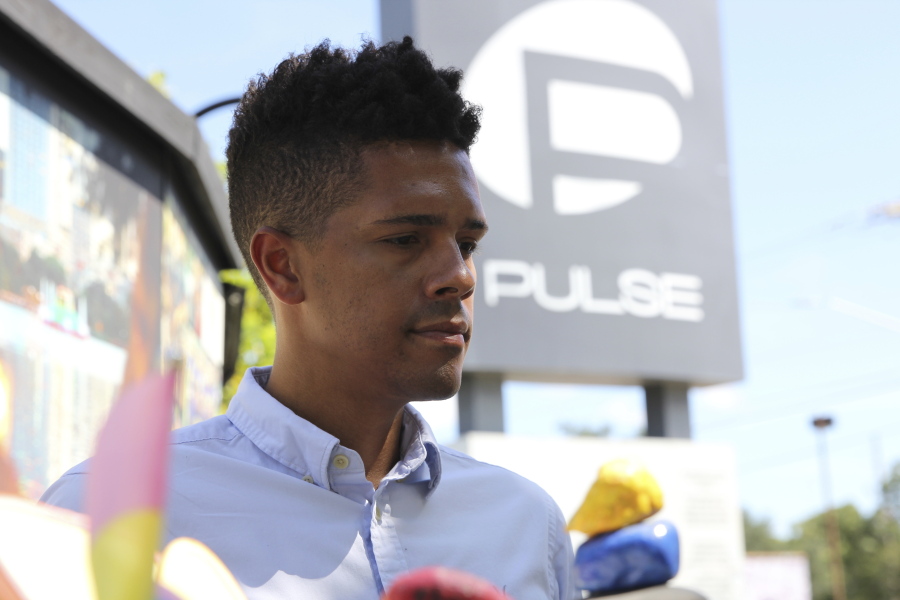 Brandon Wolf, a survivor of the Pulse nightclub shooting and activist, stands outside of the Pulse memorial in Orlando, Fla., on Sept. 9, 2022. After mass shootings, the loss felt by marginalized groups already facing discrimination is compounded. Some public health experts say the risk for post-traumatic stress disorder is greater for the groups, especially when the shootings take place at schools, churches and other vital hubs.