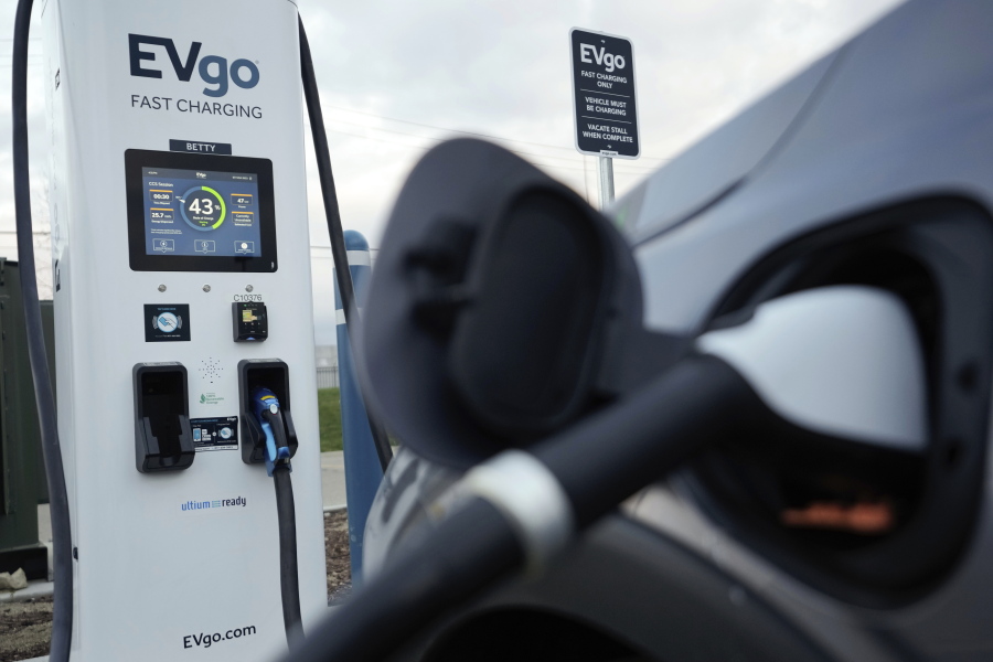 An electric vehicle charges at an EVgo fast charging station in Detroit, Wednesday, Nov. 16, 2022.