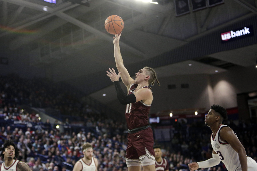 Gonzaga forward Drew Timme (2) reacts after dunking during the second half of an NCAA college basketball game against Montana, Tuesday, Dec. 20, 2022, in Spokane, Wash. Gonzaga won 85-75.