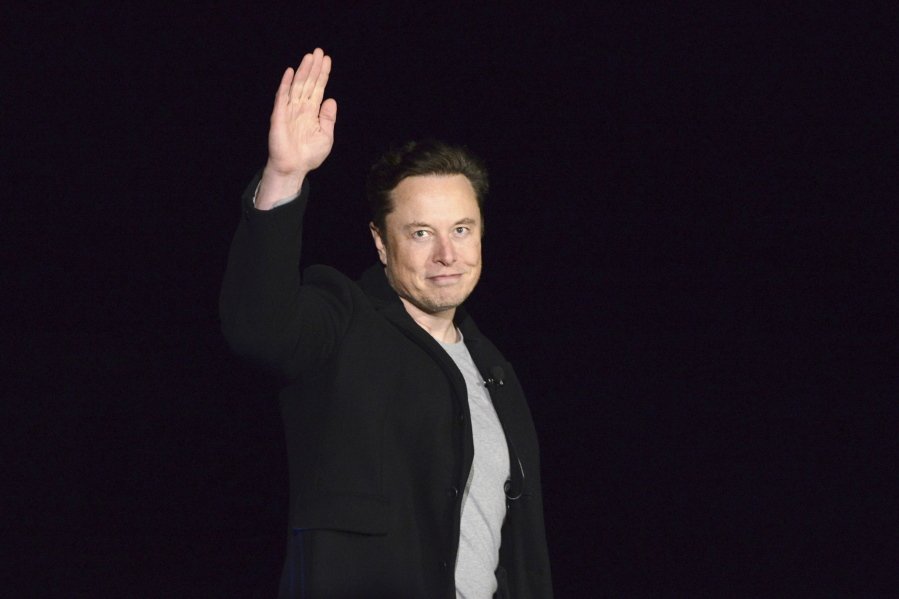 FILE - SpaceX's Elon Musk waves while providing an update on Starship, on Feb. 10, 2022, near Brownsville, Texas. Twitter on Thursday, Dec.