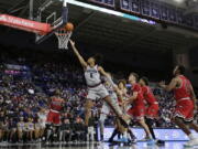 Gonzaga guard Hunter Sallis (5) shoots during the second half of a game against Northern Illinois on Monday, Dec. 12, 2022, in Spokane. The McCarthey Athletic Center on the Gonzaga campus is always sold out for basketball games and the Zags' brand recognition would be attractive for any major conference if Gonzaga were to leave the West Coast Conference.