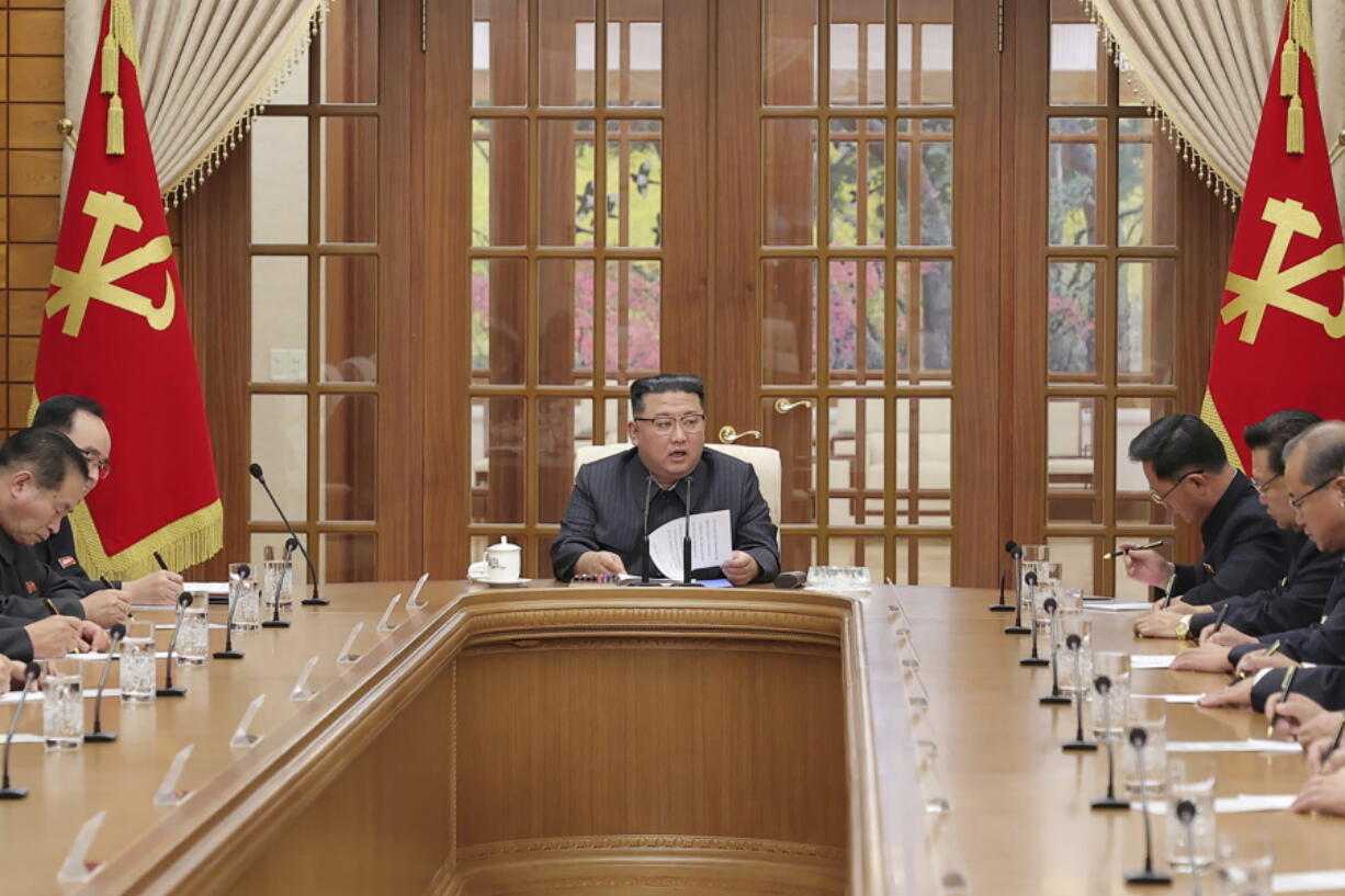 This photo provided on Dec. 1, 2022, by the North Korean government shows North Korean leader Kim Jong Un, center, attends a meeting of the Central Committee of the ruling Workers' Party in Pyongyang, on Nov. 30, 2022. Independent journalists were not given access to cover the event depicted in this image distributed by the North Korean government. The content of this image is as provided and cannot be independently verified.