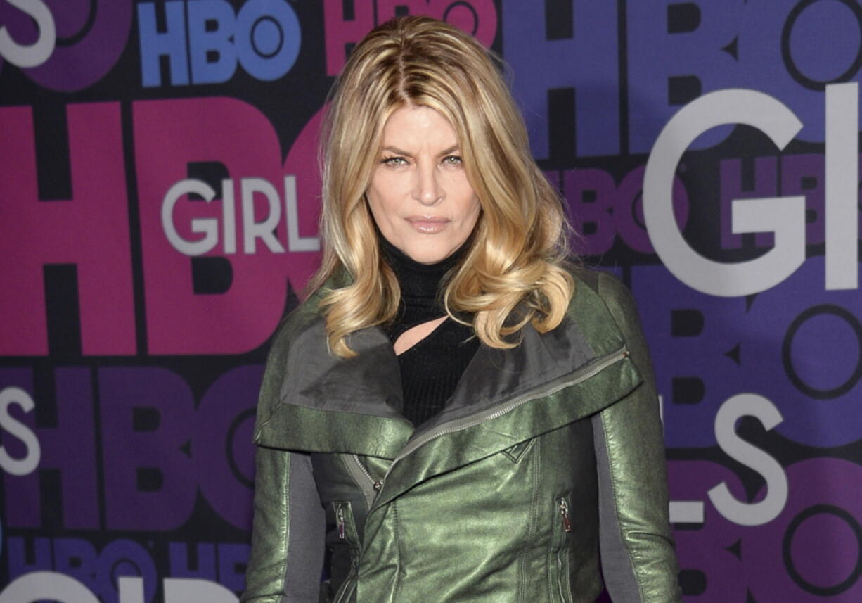 FILE -  Kirstie Alley attends the premiere of HBO's "Girls" on Jan. 5, 2015, in New York.  Alley, a two-time Emmy winner who starred in the 1980s sitcom ,??Cheers,?? and the hit film ,??Look Who,??s Talking,,?? has died. She was 71. Her death was announced Monday by her children on social media and confirmed by her manager. The post said their mother died of cancer that was recently diagnosed.