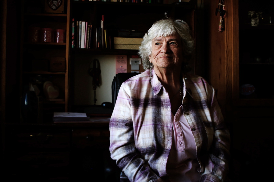 Kasey Dungan, 73, sits in her subsidized apartment in Phoenix, Ariz. for older adults on Monday, Dec. 12, 2022, and says she feels fortunate. She fell into homelessness early this year. But high costs for food and other bills mean her entire Social Security check is gone by month's end.