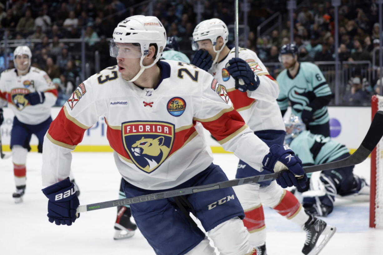 Florida Panthers center Carter Verhaeghe (23) skates from the goal after scoring his second goal of the night against the Seattle Kraken, during the first period of an NHL hockey game, Saturday, Dec. 3, 2022, in Seattle.