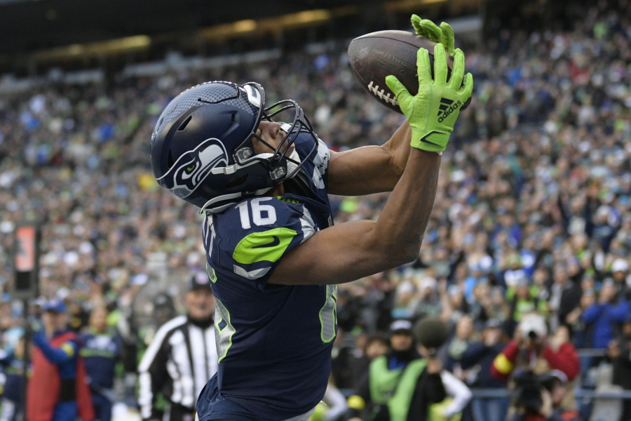 Seattle Seahawks wide receiver Tyler Lockett (16) broke a bone in his left hand on Thursday, Dec. 15, 2022, against the San Francisco 49ers. He remains hopeful to returning before the regular season is over.