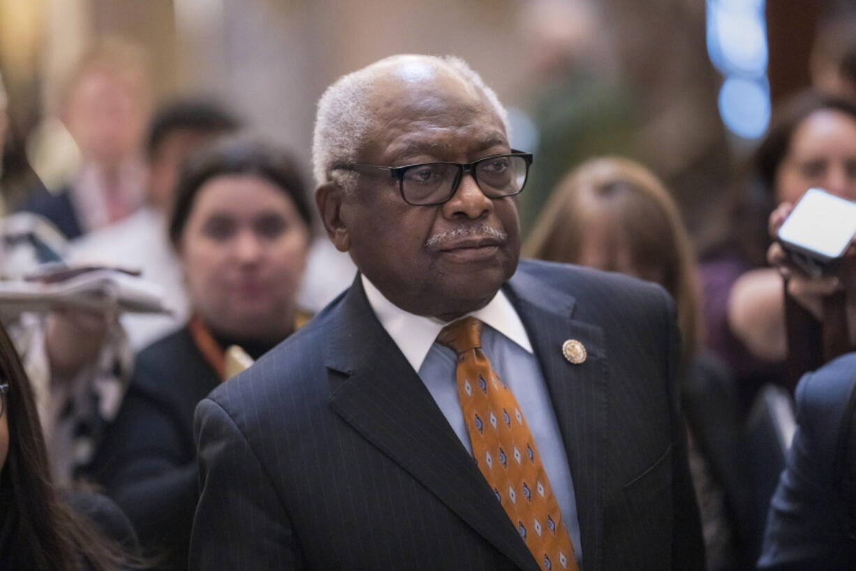 FILE - House Majority Whip James Clyburn, D-S.C., leaves the chamber at the Capitol in Washington, Nov. 17, 2022. Financial technology firms abdicated their responsibility to screen out fraud in applications for a federal program designed to help small businesses stay open and keep workers employed during the pandemic, a report by a House investigations panel said Thursday, Dec. 1. The House Select Subcommittee on the Coronavirus Crisis, chaired by Clyburn, launched its investigation of the firms in May 2021 after public reports that the firms were linked to disproportionate numbers of fraudulent loans issued under the Paycheck Protection Program. (AP Photo/J.