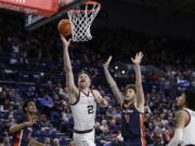 Gonzaga forward Drew Timme (2) shoots while defended by Pepperdine center Carson Basham (11) during the second half of an NCAA college basketball game, Saturday, Dec. 31, 2022, in Spokane, Wash.
