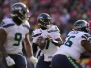 Seattle Seahawks quarterback Geno Smith (7) throws during the first half of an NFL football game against the Kansas City Chiefs Saturday, Dec. 24, 2022, in Kansas City, Mo.