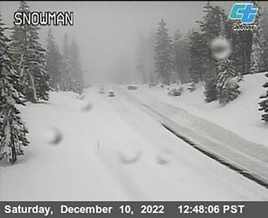 This image from a Caltrans traffic camera shows snow conditions on California SR-89 Snowman in Shasta-Trinity National Forest, Calif., Saturday, Dec. 10, 2022. A stretch of California Highway 89 was closed due to heavy snow between Tahoe City and South Lake Tahoe, Cali., the highway patrol said. Interstate 80 between Reno and Sacramento remained open but chains were required on tires for most vehicles.