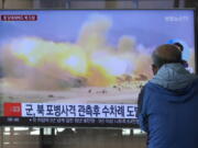 FILE - A TV screen shows a file image of North Korea's military exercise during a news program at the Seoul Railway Station in Seoul, South Korea, Wednesday, Oct. 19, 2022. South Korea's military says North Korea has fired around 130 suspected artillery rounds Monday, Dec. 5, 2022, in waters near the rivals' western and eastern sea borders in another display of belligerence.