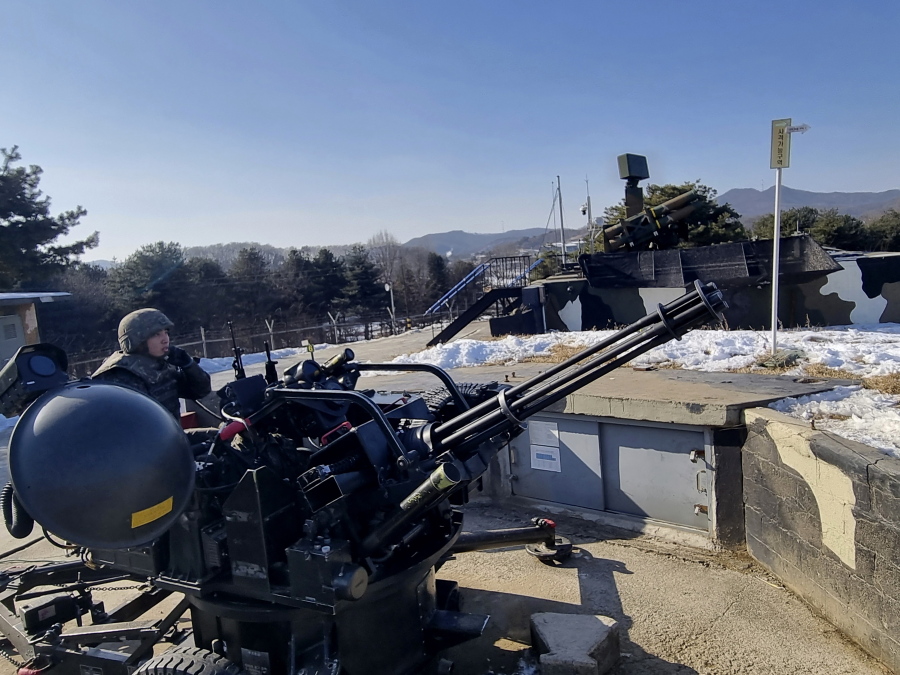 In this photo provided by South Korea Defense Ministry, South Korean soldiers operate a vulcan automatic cannon during a military exercise in Yangju, South Korea, Thursday, Dec. 29, 2022. South Korea staged large-scale military drills Thursday to simulate shooting down drones as a step to bolster its readiness against North Korean provocations, three days after the North flew drones into its territory for the first time in five years.