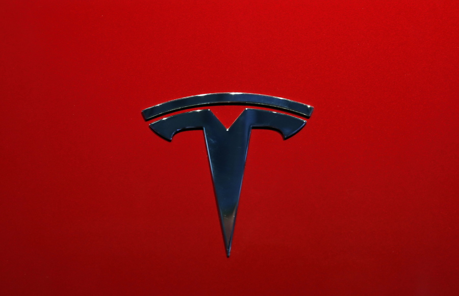 FILE- The logo of Tesla model 3 is seen at the Auto show on Oct. 3, 2018, in Paris. Tesla delivered its first electric semis to PepsiCo Thursday, Dec. 1, 2022, more than three years after Elon Musk said the company would start making the trucks.