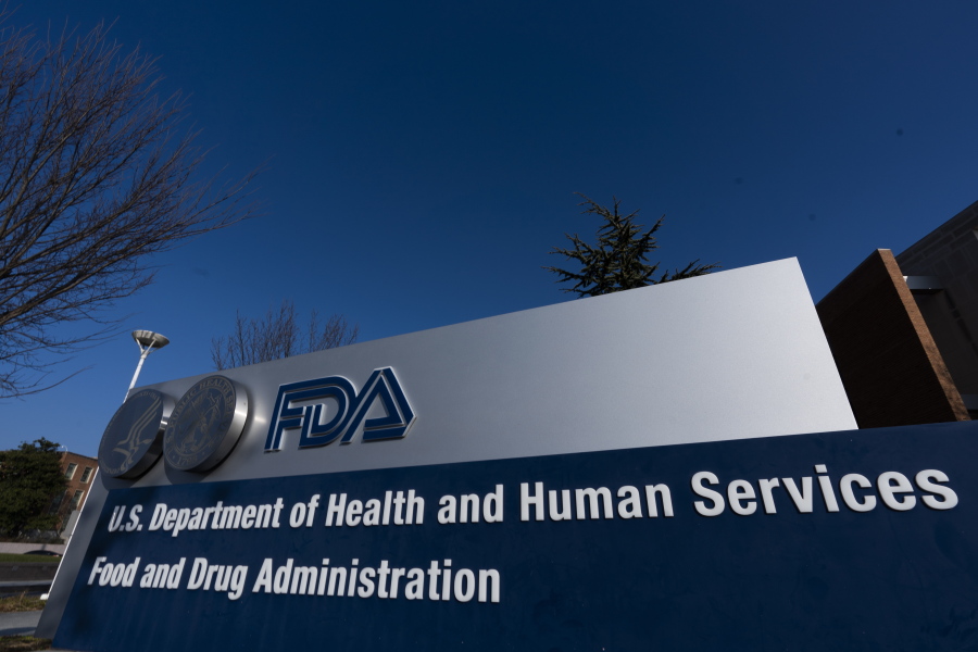 FILE - A sign in front of the Food and Drug Administration building is seen on Dec. 10, 2020, in Silver Spring, Md. The FDA's tobacco division is plagued by a lack of clear direction and priorities that have hampered its ability to regulate electronic cigarettes and other products under its oversight, according to a report released Monday, Dec. 19, 2022.