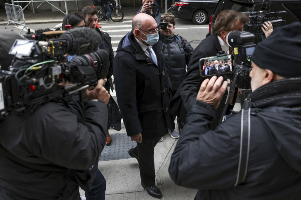 FILE - Trump Organization's former Chief Financial Officer Allen Weisselberg, center, arrives to court on Nov. 15, 2022, in New York. Closing arguments are slated for Thursday, Dec. 1, in Donald Trump's company's criminal tax fraud case. Prosecutors and defense lawyers say those could take seven hours or more. Those projections speak to the complexity of the case, which stems from longtime Trump Organization finance chief Weisselberg's 15-year scheme to avoid taxes on company-paid perks including an apartment and luxury cars.