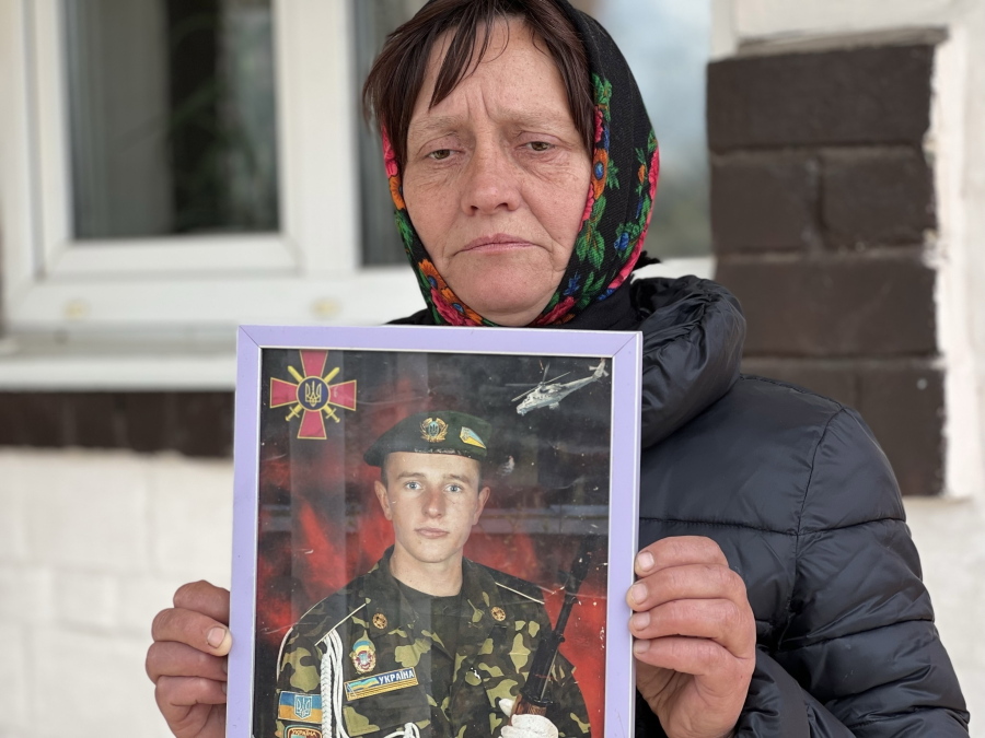 Olena Balai holds a photo of her only son, Viktor Balai, a 28-year-old veteran of the war, in Zdvyzhivka, Ukraine on April 30, 2022. Olena identified his body in eastern Ukraine's Donbas region, on the forest floor. "His brain was leaking out of his head," she said. "The face and mouth were torn apart, the teeth knocked out. There was no space left alive on his body. What pain he bore." She was weeping even as she spoke, her voice a wail of words. "Who would torture a kid?" she said. "I want them to be found and punished." Viktor was her only son. "I have no one else," she said, struggling to breathe.