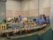 A model logging train winds around a display track assembled by the Rose City Garden Railway Society on Saturday during the Great Train Show at the Clark County Event Center. Dozens of vendors also filled the space, selling everything a model railroad enthusiast could need: engines, figurines, decals, books and anything else related to trains.