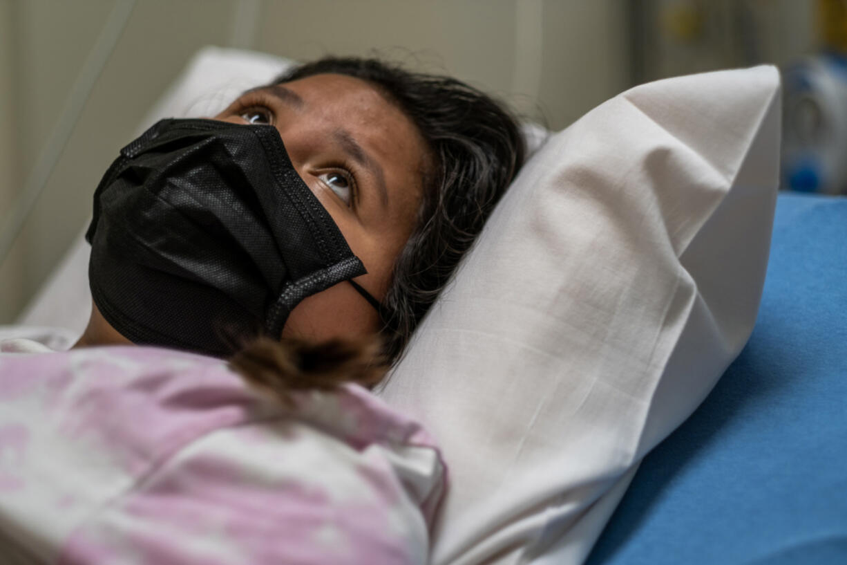Merlina Segeda Rendon in the emergency department at Loma Linda University Children???s Hospital. The 12-year-old, who has leukemia, had tested positive for the coronavirus on a rapid test at home. At times, the preteen translated questions into Spanish for her mother.