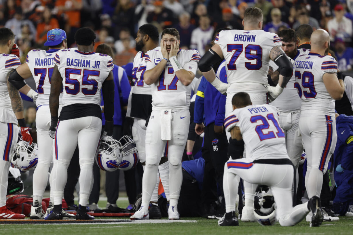 Buffalo Bills players react after teammate Damar Hamlin (3) was injured against the Cincinnati Bengals during the first quarter at Paycor Stadium on January 02, 2023, in Cincinnati, Ohio.