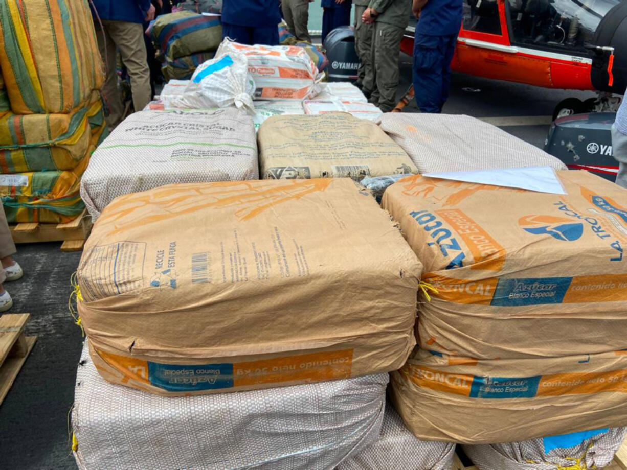 Packages of cocaine and marijuana are stacked on the deck of the U.S. Coast Guard Cutter James Thursday, Feb. 17, 2022.