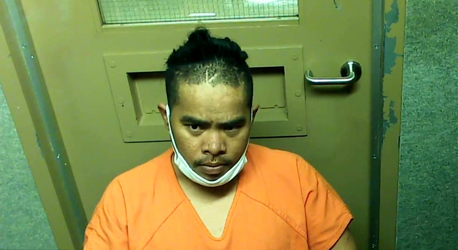 Ttong John, 30, appears Aug. 23 in Clark County Superior Court on suspicion of first-degree robbery and hit-and-run resulting in injury. He was sentenced Wednesday to four years in prison for stealing a man's car and running the owner over when he tried to stop him.