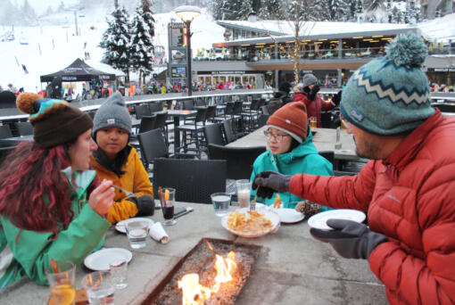 Whistler Blackcomb draws visitors from near and far, like this group from Atlanta enjoying food and drinks at the Longhorn Pub after a day of skiing.