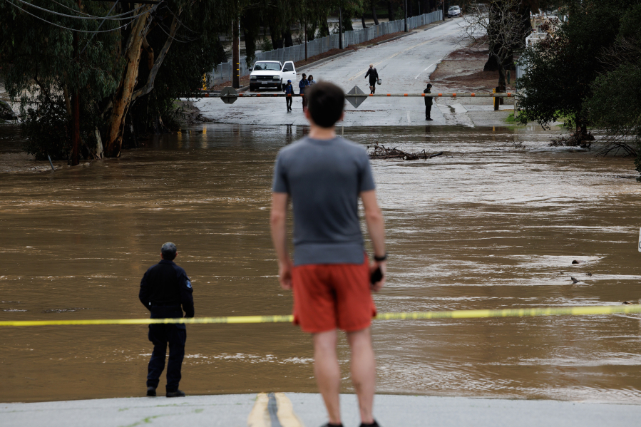 Uvas Creek floods a section of Miller Avenue in Gilroy, California, as the latest series of atmospheric rivers hit the Bay Area on Monday, Jan. 9, 2023.