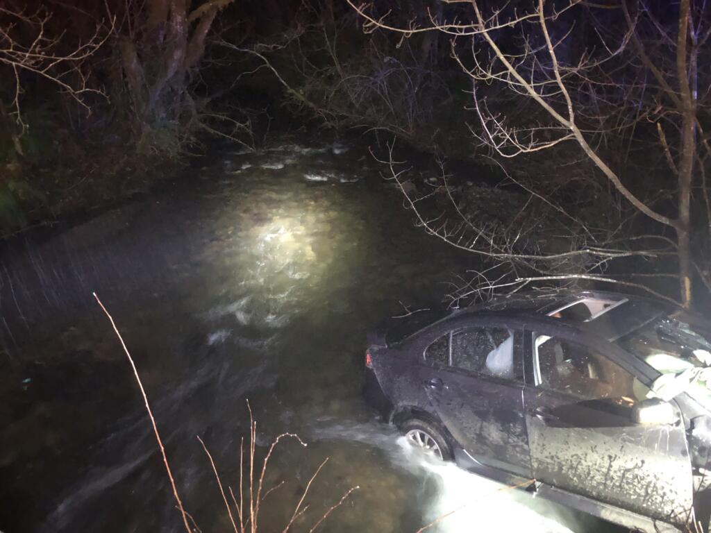 Four people were hurt in a crash after a car went off Boulder Creek Road and ended up partially submerged in Boulder Creek.