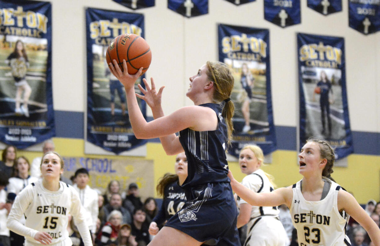 King’s Way Christian’s Bridget Quinn, center, goes up for a shot during a Trico League girls basketball game against Seton Catholic on Tuesday, Jan. 31, 2023, at Seton Catholic College Prep.