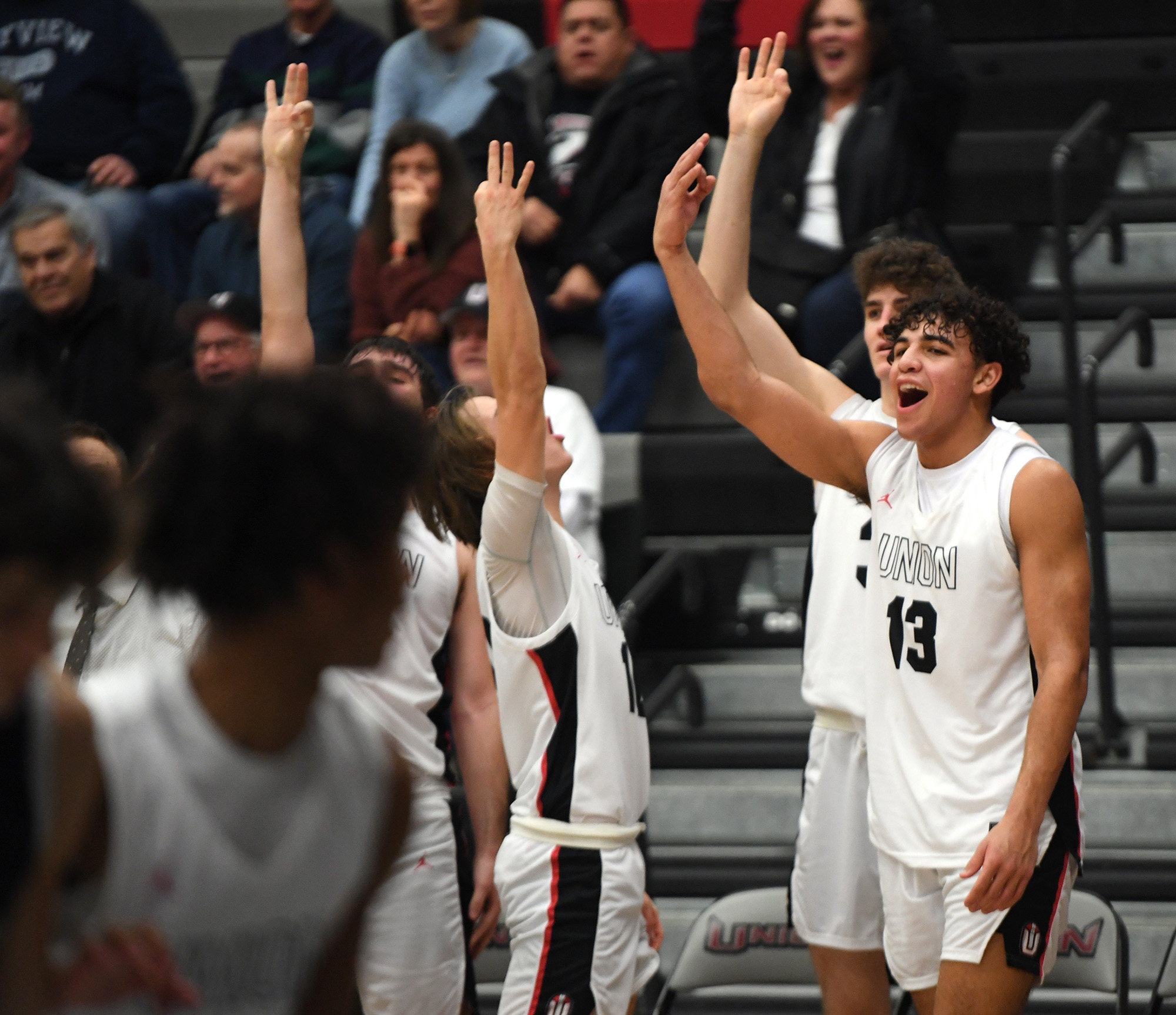 Union starters celebrate in the waning seconds Friday, Jan. 6, 2023, during the Titans’ 61-41 win against Skyview at Union High School.