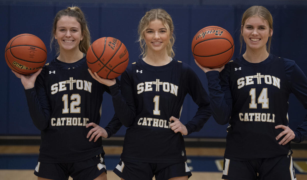 Seton Catholic basketball players Anna Mooney (12), Keira Williams (1) and Hannah Jo Hammerstrom (14) have the team off to a successful start.
