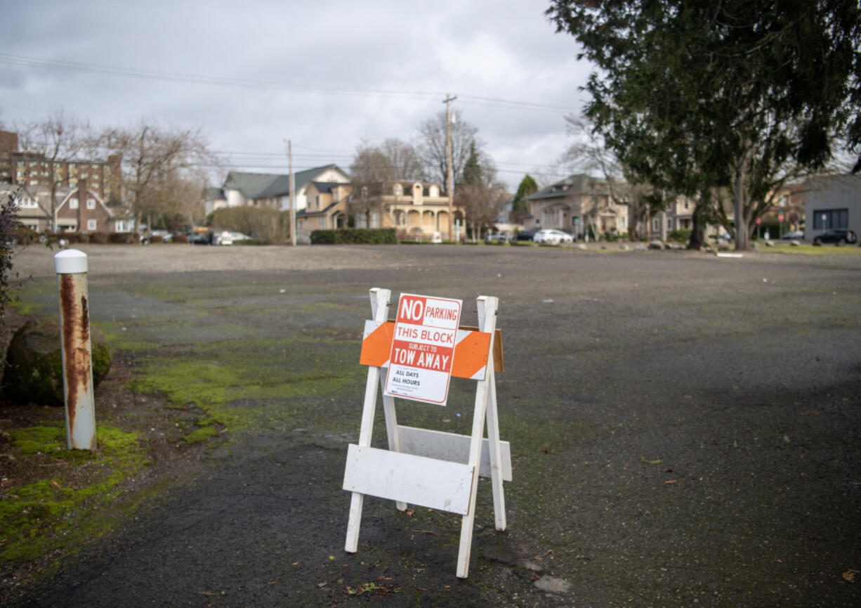A no-parking sign blocks an entrance to the empty lot that is the proposed location of the third Safe Stay site in downtown Vancouver.