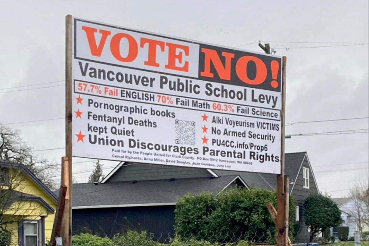 A sign posted by opponents of a replacement levy for Vancouver Public Schools says it was financed by People United for Clark County, a local right-wing political action committee.
